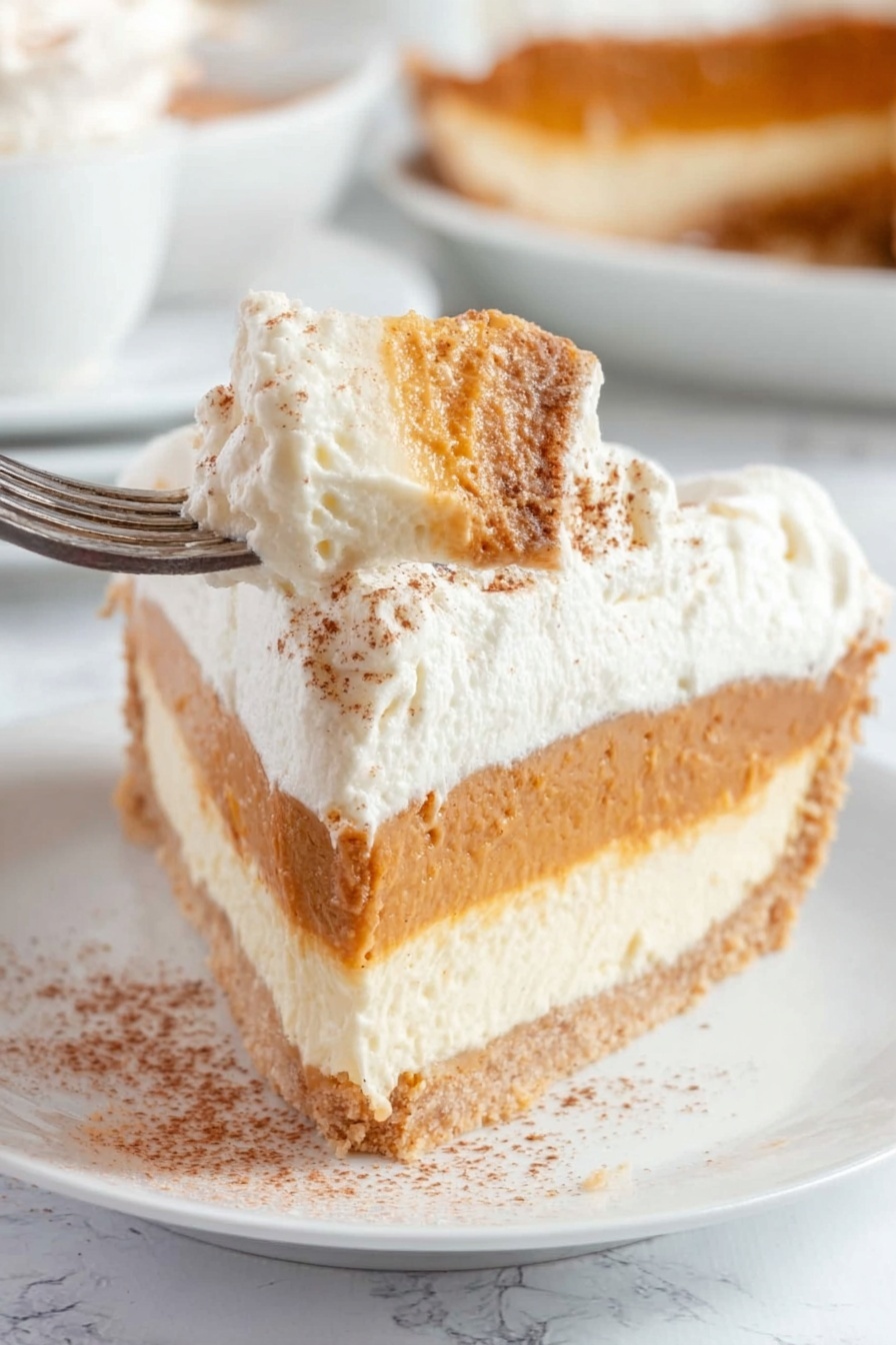 A slice of pie is shown with three clear layers on a white plate. The bottom layer is a light brown crumbly crust. Above it is a thick creamy white layer, smooth in texture. The middle layer is a rich orange-brown, slightly thicker than the white layer, with a soft consistency. The top layer is fluffy white whipped cream, thick and spread evenly, with small brown specks sprinkled over it. The background is a white marbled texture with a pie dish blurred in the back. Photo taken with an iphone --ar 2:3 --v 7