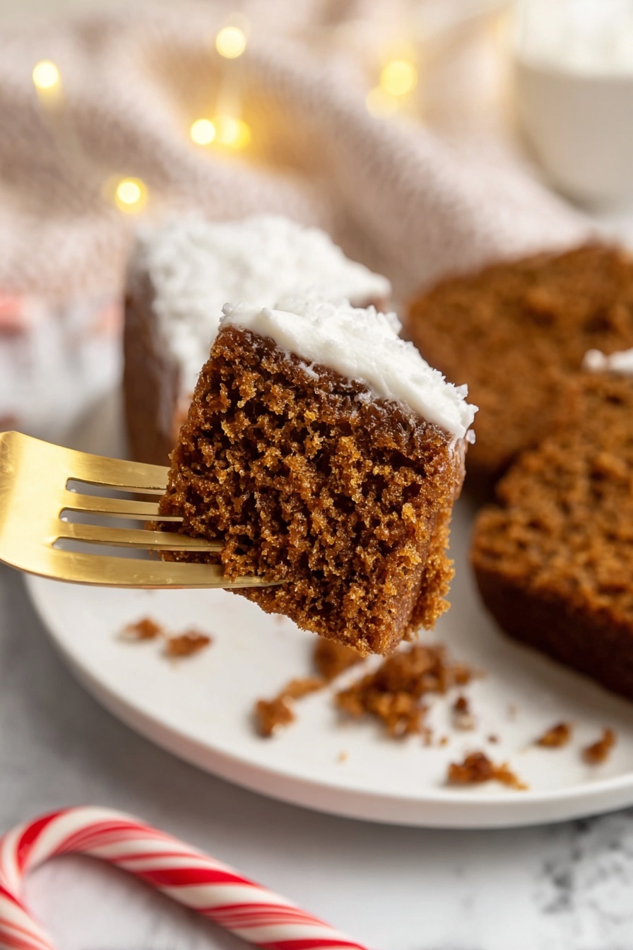 A close-up of a single thick slice of brown cake with a light, fluffy white frosting layer on top. The frosting is sprinkled with fine white flakes, adding a textured look. The cake slice is placed on a light wooden board that contrasts with the white frosting and brown cake. A brown knife with two oval holes is partially stuck into the frosting on the right side of the slice. The background has a soft beige cloth and a white marbled surface with warm, soft lighting. photo taken with an iphone --ar 2:3 --v 7